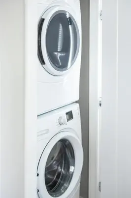 a washing machine and a dryer in a room at Luxury Downtown Townhome Private Garage Unit 10 in Cleveland