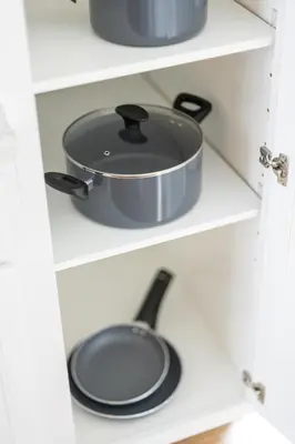 a pot and pan on a shelf in a kitchen at Luxury Downtown Townhome Private Garage Unit 11 in Cleveland