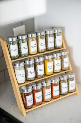 a wooden shelf filled with jars of spices at Luxury Downtown Townhome Private Garage Unit 11 in Cleveland
