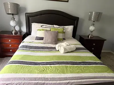 a bedroom with a bed with two towels on it at Private Cul-de-Sac Oasis 4BR in Grove City