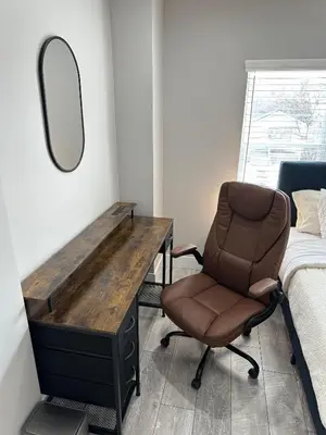 a bedroom with a desk and a chair and a mirror at Urban Retreat 2BR Near Downtown in Columbus