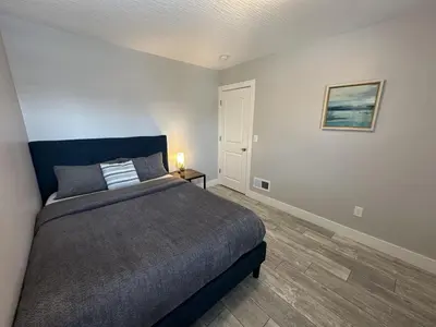 a bedroom with a large bed in a room at Urban Retreat 2BR Near Downtown in Columbus