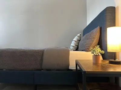 a living room with a couch and a table at Urban Retreat 2BR Near Downtown in Columbus