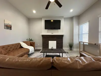 a living room with a couch and a fireplace at Urban Retreat 2BR Near Downtown in Columbus