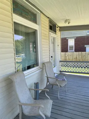 two chairs on the porch of a house at Private tiny room for one in Cincinnati