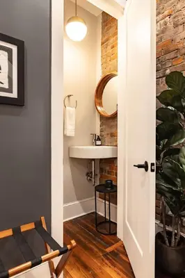 a bathroom with a sink and a mirror at Luxury 4BR - Washington Park - Walk Everywhere in Cincinnati