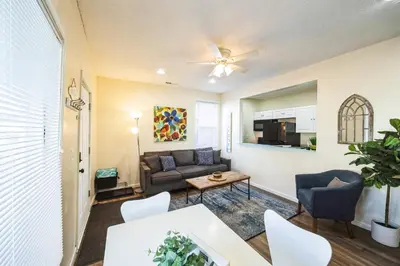 a living room with a couch and a table at Charming Getaway on Ash St- Minutes from Cinci in Ludlow