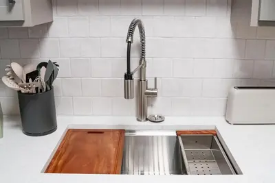 a kitchen counter with a sink and a sink at Little Gem in Millersburg