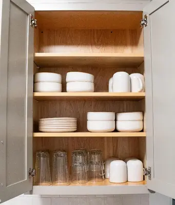 a cupboard filled with plates and dishes at Little Gem in Millersburg