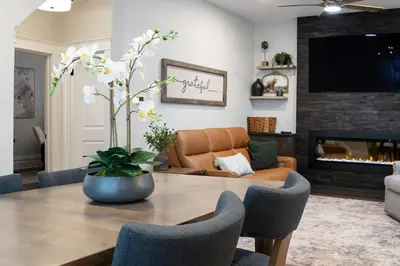 a living room with a table and a couch at Little Gem in Millersburg