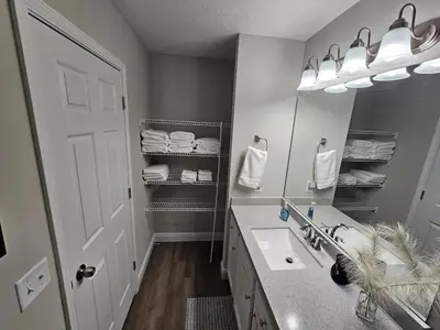 a bathroom with a sink and a mirror at Amazing New Wilmington Ranch in Wilmington
