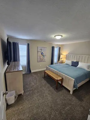 a bedroom with a bed and a television in it at Cute New Const Wilmington Ranch in Wilmington