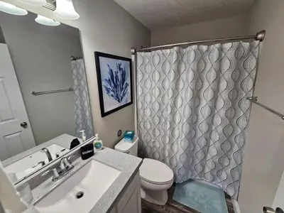 a bathroom with a sink and a toilet and a shower at Cute New Const Wilmington Ranch in Wilmington