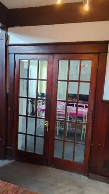 a wooden door with glass windows in a room at Valley and city views in Steubenville