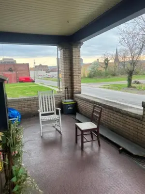 two chairs and a table on a porch at Valley and city views in Steubenville