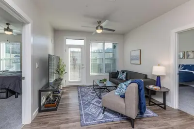 a living room with a couch and a bed at Stylish & Spacious Stay Near The Banks in Cincinnati