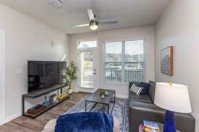 a living room with a couch and a tv at Modern Stay Close to Dining & Entertainment in Cincinnati
