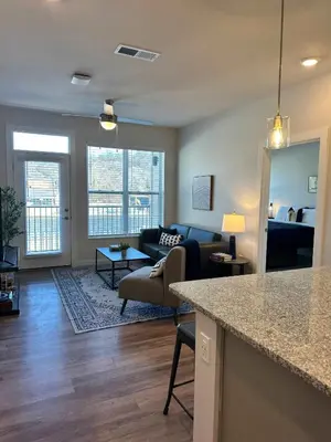 a living room with a couch and a table at Modern Stay Close to Dining & Entertainment in Cincinnati