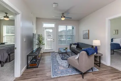 a living room with a couch and a bed at Modern Stay Close to Dining & Entertainment in Cincinnati