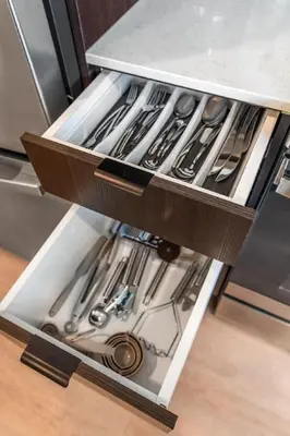 a drawer in a refrigerator filled with utensils at OTR 1 Bed Suite Free Parking Gym Pool Clubroom in Cincinnati