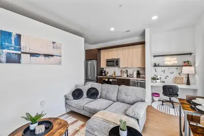 a living room with a couch and a table at OTR 1 Bed Suite Free Parking Gym Pool Clubroom in Cincinnati