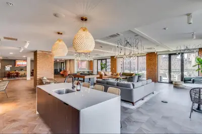 a large room with a kitchen and a living room at OTR 1 Bed Suite Free Parking Gym Pool Clubroom in Cincinnati