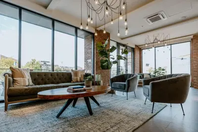 a living room with a couch and a table at OTR King Bed Free Parking Gym Top Floor Club Room in Cincinnati