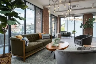 a living room with a couch and a table at OTR King Bed Free Parking Gym Top Floor Club Room in Cincinnati