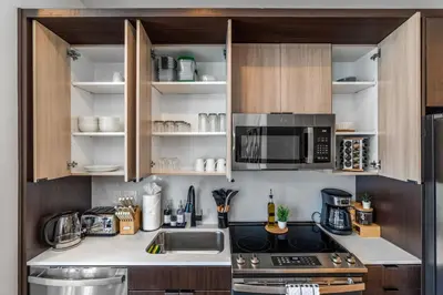 a kitchen with a sink and a microwave at OTR King Bed Free Parking Gym Top Floor Club Room in Cincinnati