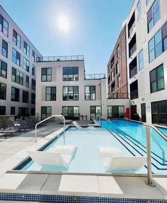 a swimming pool in the middle of a building at OTR King Bed Free On Site Parking Gym Pool Club Room in Cincinnati