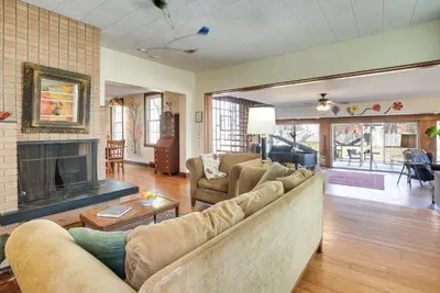 a living room with a couch and a fireplace at Spacious and Updated Farmhouse in Yellow Springs in Fairborn