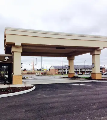 a large parking lot with a gas station at Comfort Suites-Youngstown North in Youngstown
