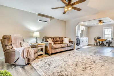 a living room with two chairs and a ceiling fan at 15 Mi to Summit Lake State Park Updated Apt! in Hagerstown