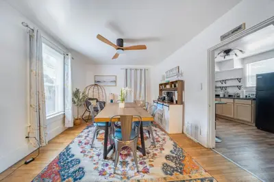 a dining room with a table and a kitchen at Kenmore Akron 3 bedroom 1 bath in Akron