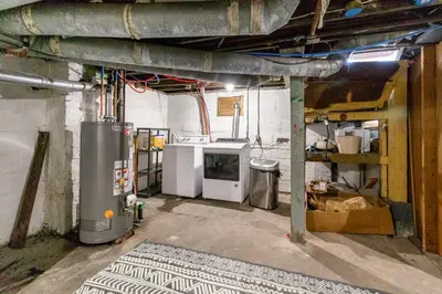 a kitchen with a heater and a stove in a room at Kenmore Akron 3 bedroom 1 bath in Akron