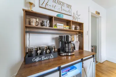 a kitchen counter with a coffee maker on a shelf at Kenmore Akron 3 bedroom 1 bath in Akron