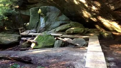 a park with a bench and some rocks at Cabin in the treetops! in Lancaster