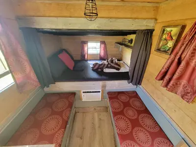 an overhead view of a bedroom in a tiny house at Cozy Tiny House on Working Farm, for Fun Glamping Trips in Kentucky in Owenton