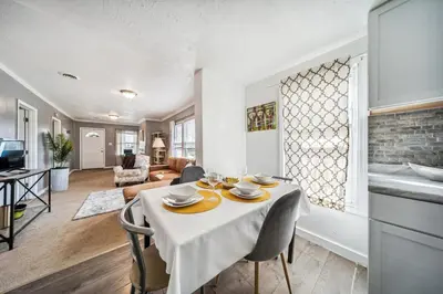 a kitchen and living room with a table and chairs at 3 bedroom 1 bath in Cleveland in Cleveland
