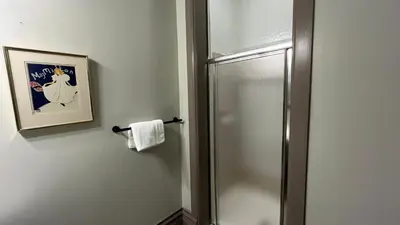 a bathroom with a shower with a towel at Stone Gables Inn in Cleveland