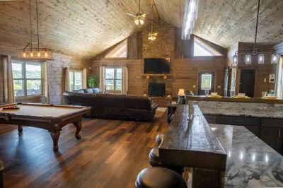 a large living room with a pool table in it at Serenity Ridge- Scenic Luxury Log Estate Getaway in McArthur