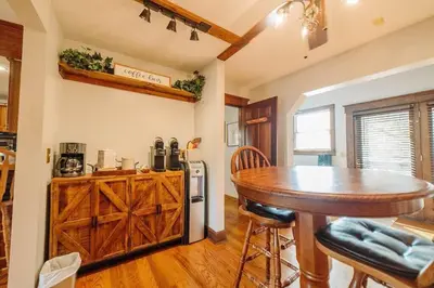 a kitchen with a wooden table and a wooden counter at Majestic Home in Hocking wPool Jacuzzi Basketball in McArthur