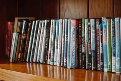 a row of books sitting on a book shelf at Majestic Home in Hocking wPool Jacuzzi Basketball in McArthur