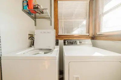 a small kitchen with a washing machine and a sink at Majestic Home in Hocking wPool Jacuzzi Basketball in McArthur