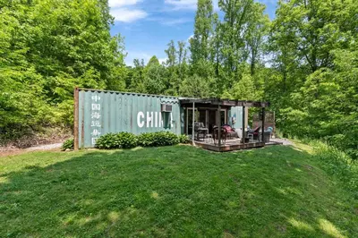 a green shipping container with a yard at Unique Dover Accommodation with a Hot Tub Perfect for Glamping in Ohio in Dover