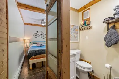 a tiny bathroom with a bunk bed and a toilet at Unique Dover Accommodation with a Hot Tub Perfect for Glamping in Ohio in Dover