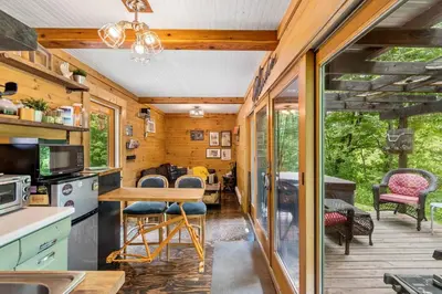 a kitchen and dining area of a tiny house at Unique Dover Accommodation with a Hot Tub Perfect for Glamping in Ohio in Dover