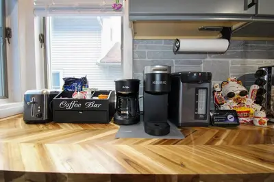 a coffee maker sitting on top of a wooden counter at The Wilderness, Near CP & SF, W&D, Pet OK in Sandusky