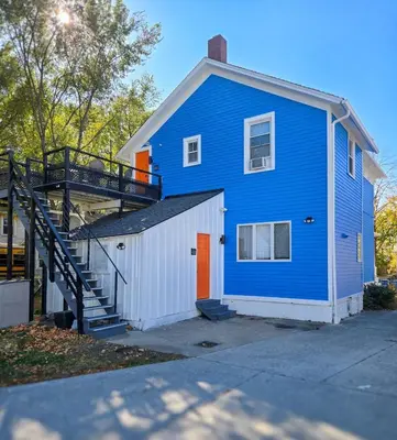 a blue house with a staircase in front of it at The Wilderness, Near CP & SF, W&D, Pet OK in Sandusky