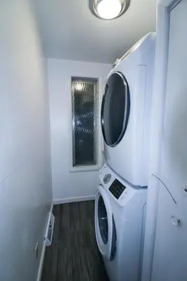 a laundry room with a washing machine and a window at The Wilderness, Near CP & SF, W&D, Pet OK in Sandusky
